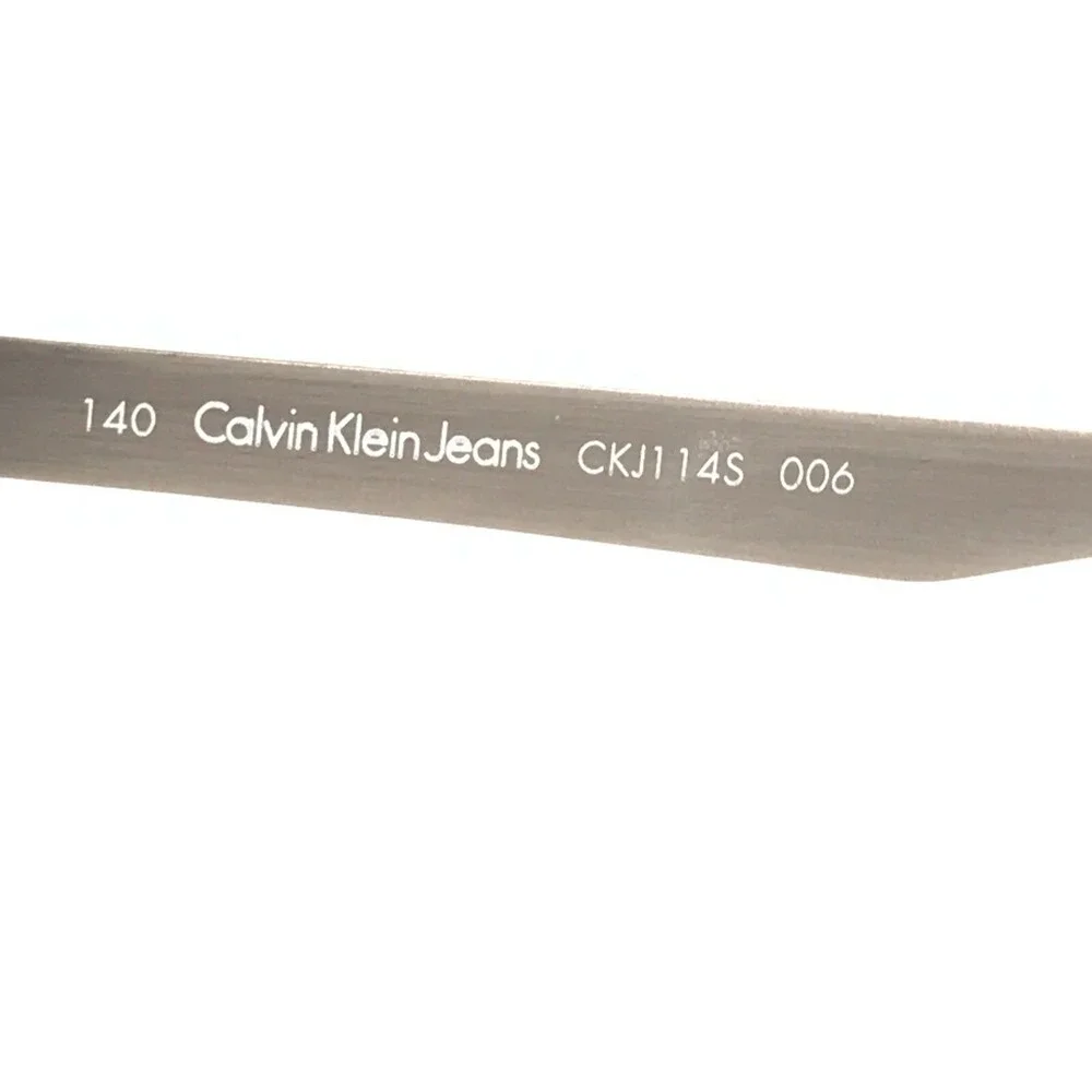 Calvin Klein Jeans Sunglasses CKJ114S 006 Gray Round Frames with Purple Lenses